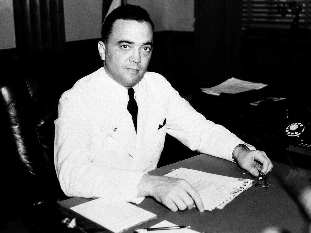 J. Edgar Hoover is seen in his Washington, D.C., office in 1936. A new biography of the long-time FBI director looks at public support for his policies during most of his tenure.