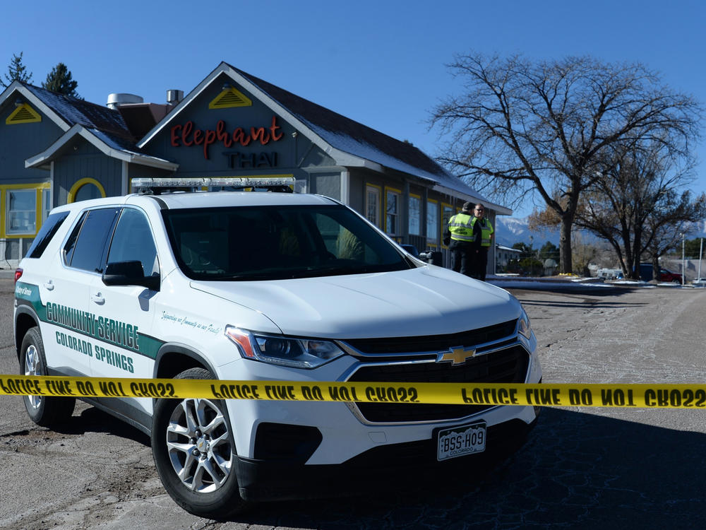 A Colorado Springs community service vehicle is parked Sunday near a gay nightclub in Colorado Springs, Colo., where a shooting occurred late Saturday night.