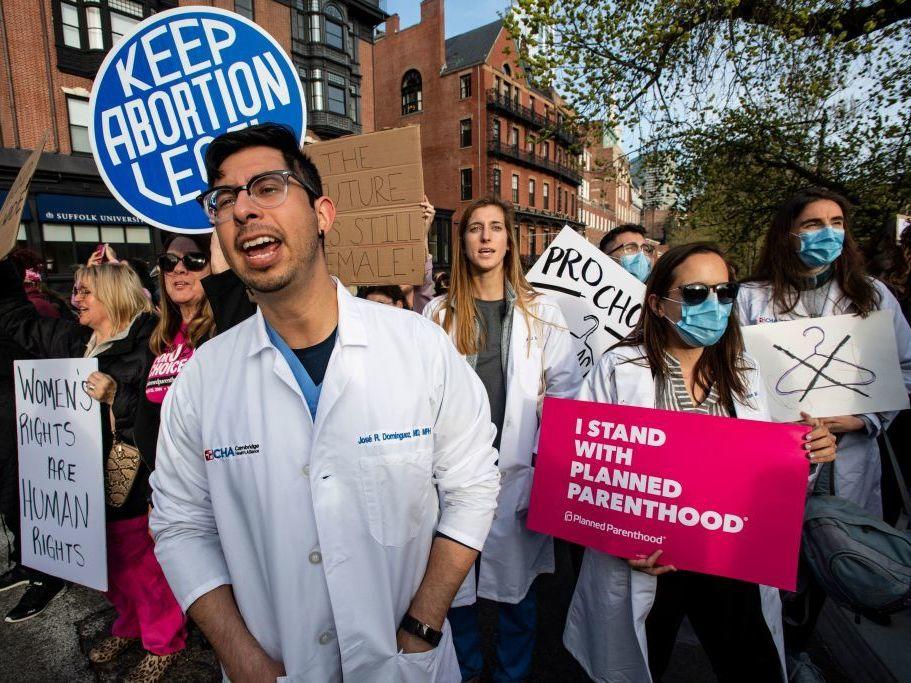A group of doctors and medical workers protested in support of abortion rights in Boston, Mass., May 3, 2022 when the Supreme Court was poised to strike down the right to abortion in the U.S. Many doctors believe that outlawing abortion infringes on their ability to practice medicine ethically.