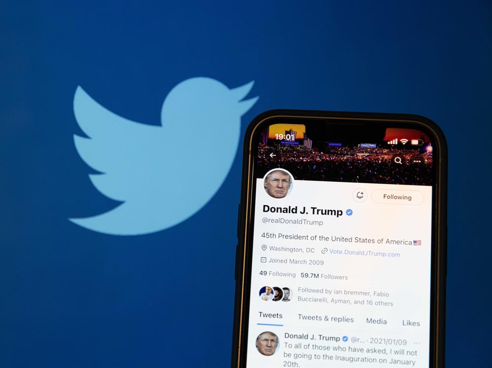 A photo illustration shows the reactivated Twitter profile of former US President Donald Trump. Elon Musk reinstated him on the social media platform on November 19, 2022.