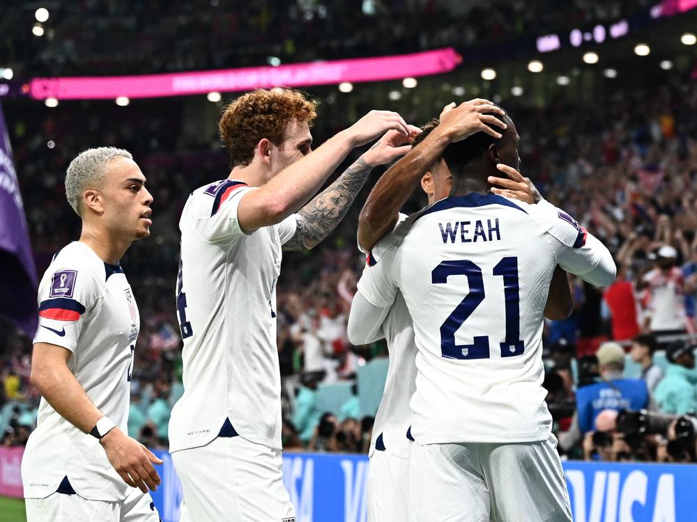 The U.S. men's national team celebrates after Timothy Weah's goal in the first half of a match with Wales in the FIFA World Cup.