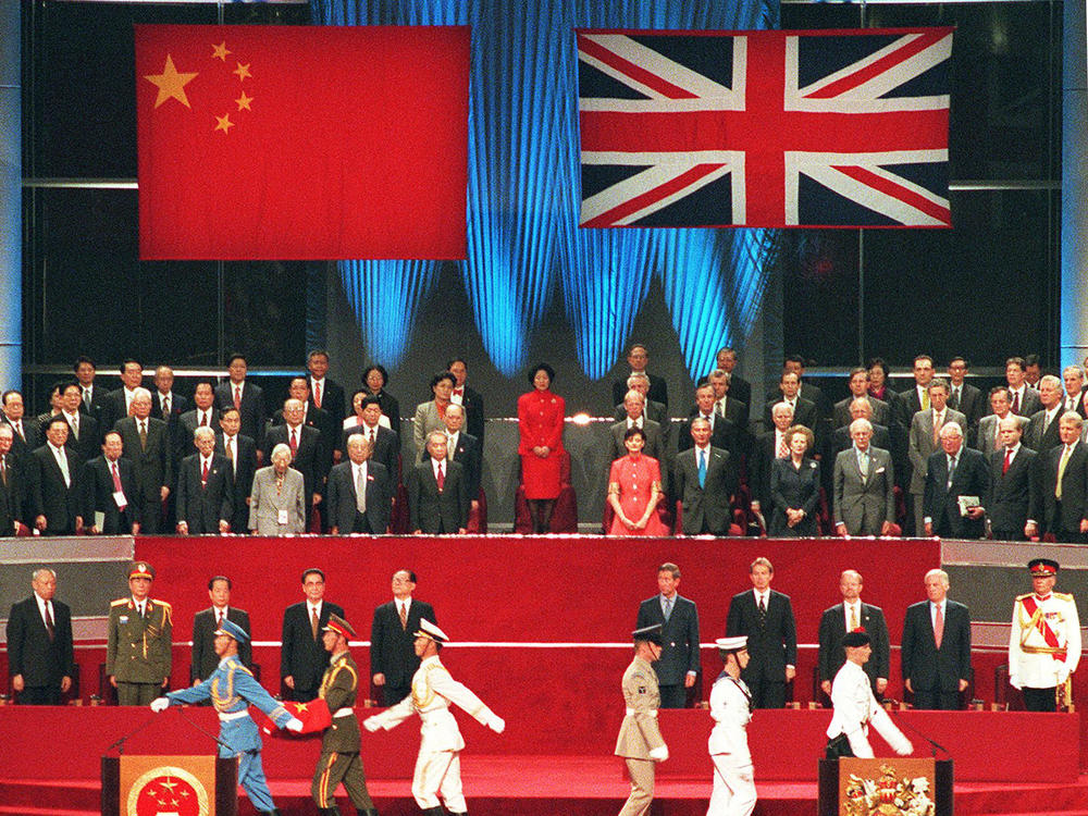 Chinese President Jiang Zemin (center left) takes part in the official handover ceremony, marking Britain's return of Hong Kong to China on July 1, 1997, in Hong Kong. This ended 156 years of British colonial rule over the territory.