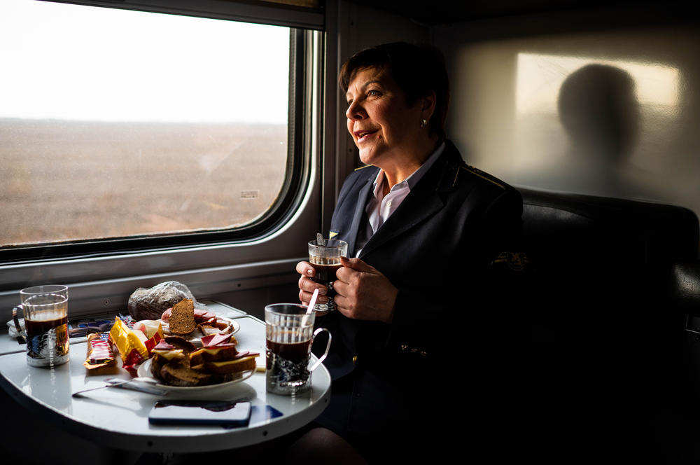 Ukrainian Railways employee Halyna Rospodnyuk eats a breakfast of traditional Ukrainian salo (cured pork fat) sandwiches on the train.