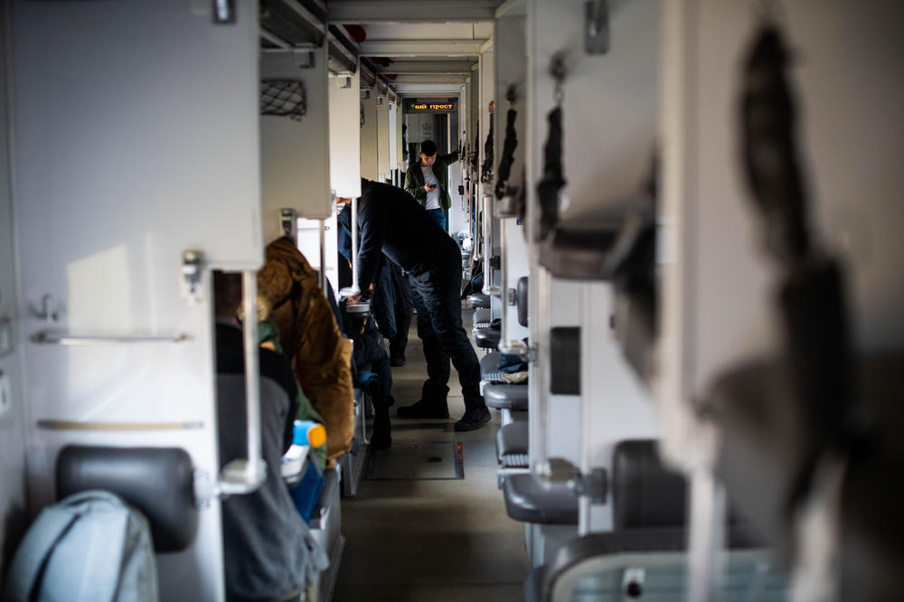 Passengers ride the first Ukrainian Railways train to recently liberated Kherson on Saturday.