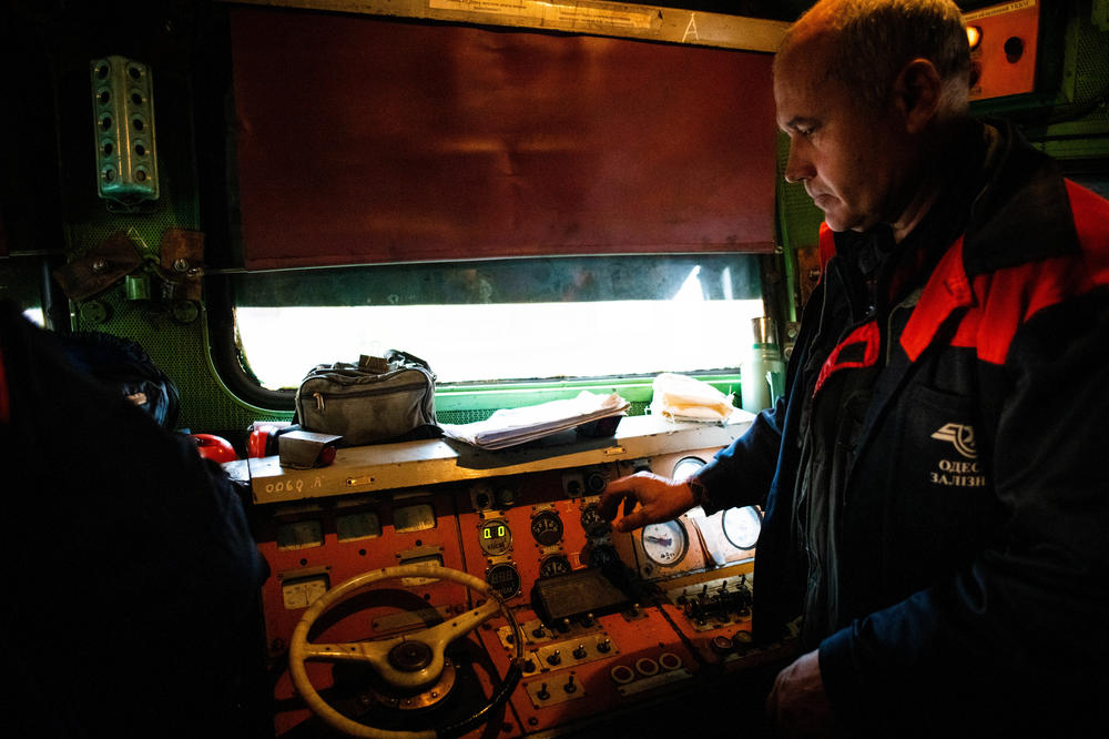 A Ukrainian Railways train operator in Mykolaiv, Ukraine, prepares the train for the first trip to recently liberated Kherson on Saturday.