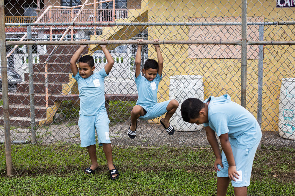 The RodrÃ­guez brothers at their neighborhood ballpark last month.