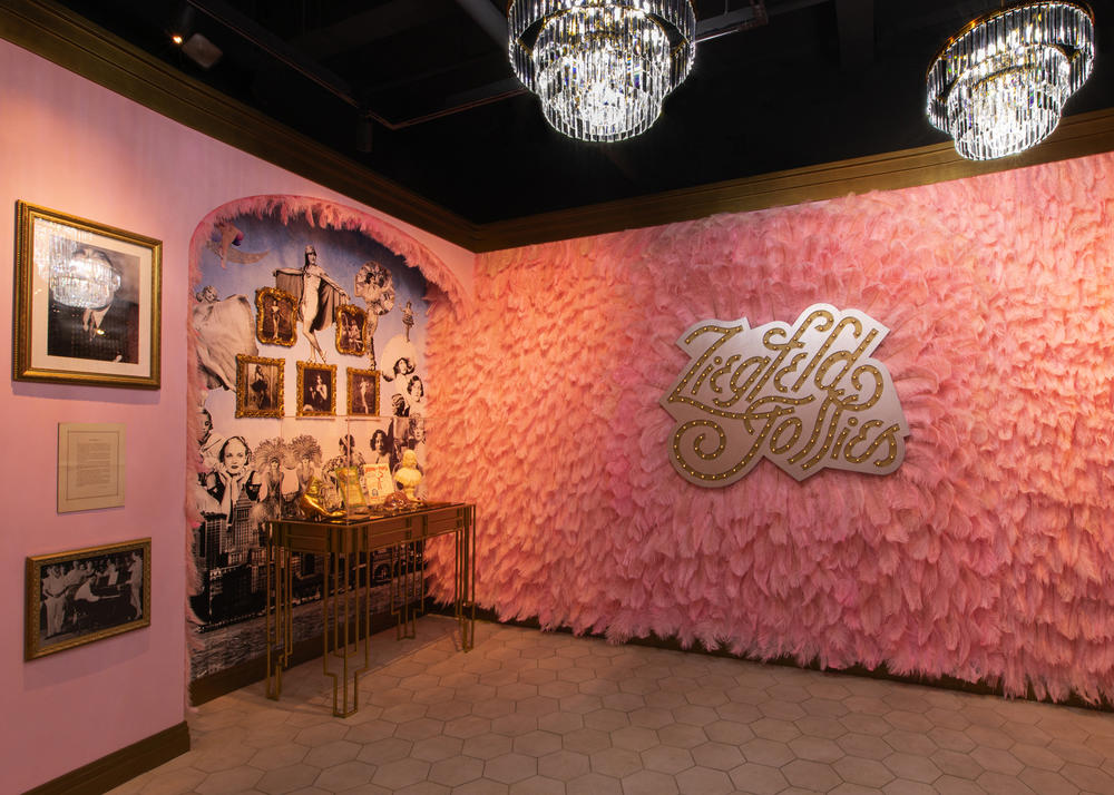 The Ziegfeld Follies room is wallpapered with pink feathers.