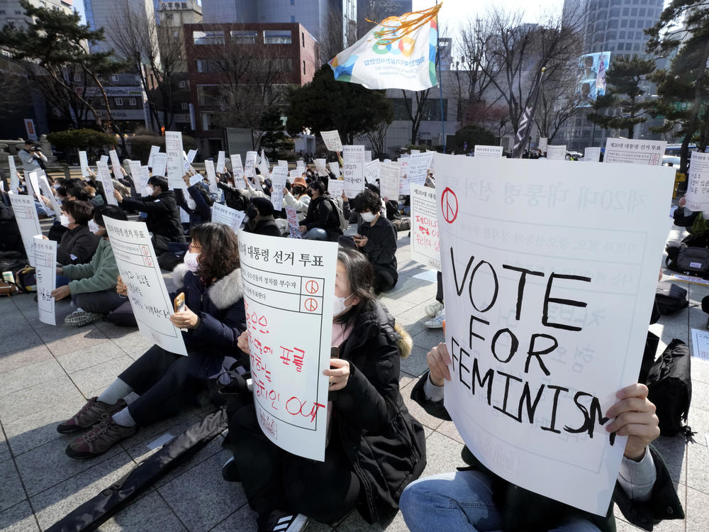 People stage a rally supporting feminism in Seoul in February. Many feminist activists have to operate anonymously over fears of death threats.