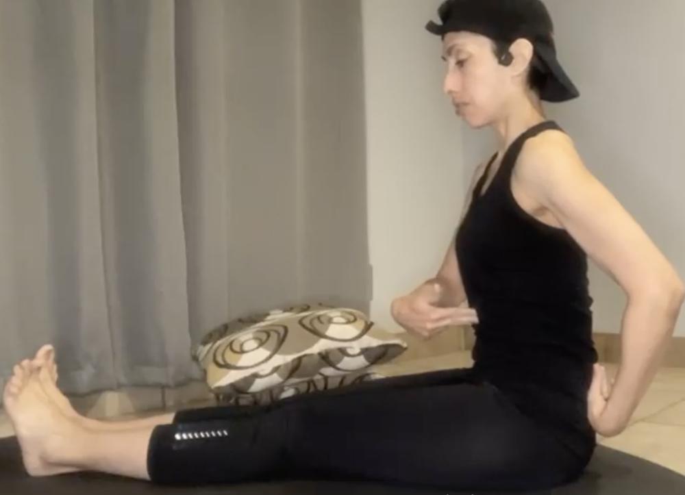 Cathy Perez teaching a remote yoga class