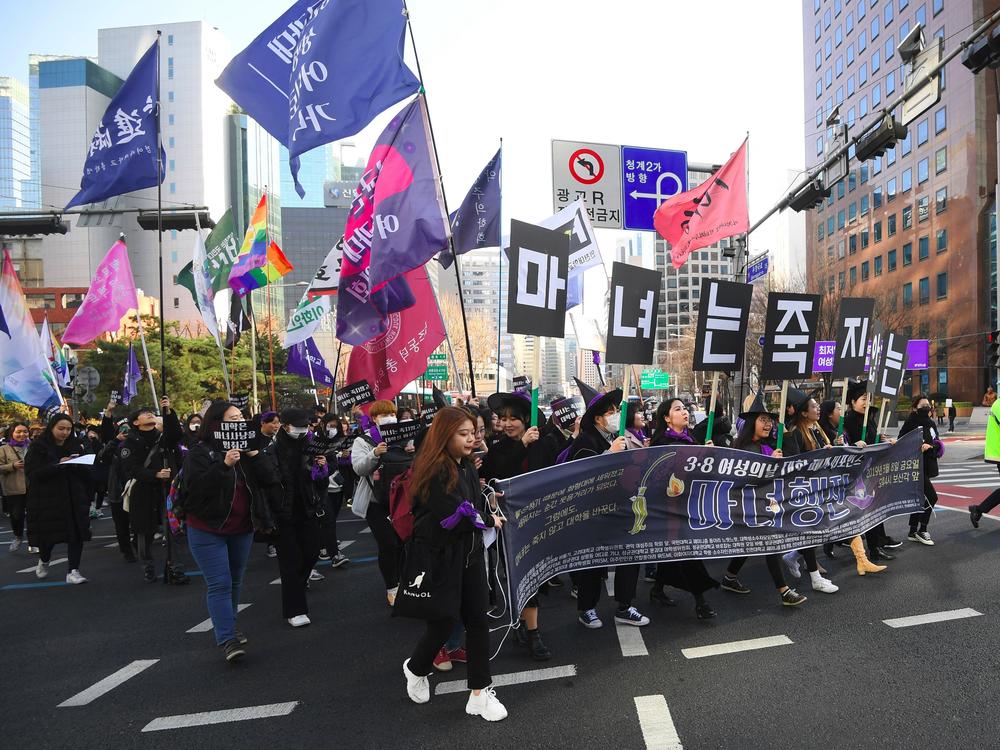 South Korean women take part in a march supporting feminism during a protest to mark International Women's Day in Seoul on March 8, 2019. Anti-feminism has been on the rise, turbocharged this year by President Yoon Suk Yeol.
