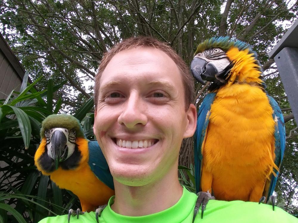 Kenneth Reese with two Macaws