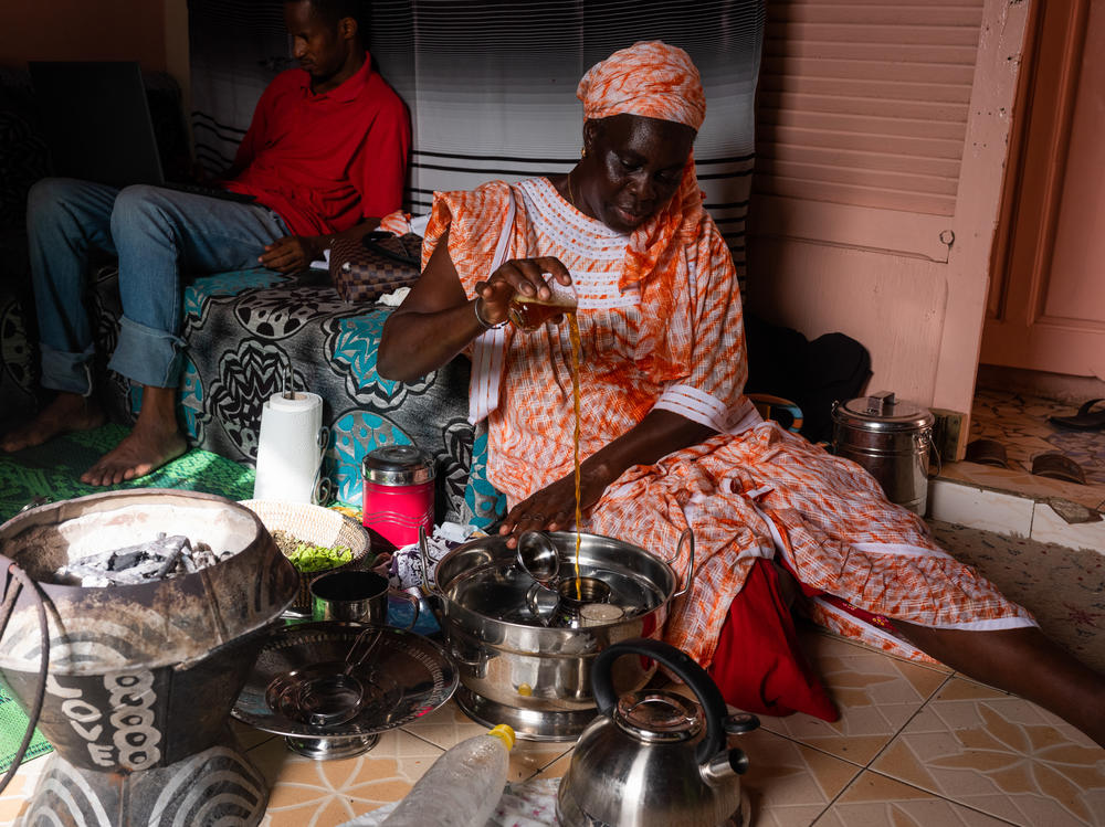 Yaram Fall makes tea in her home in Guet Ndar, Senegal.