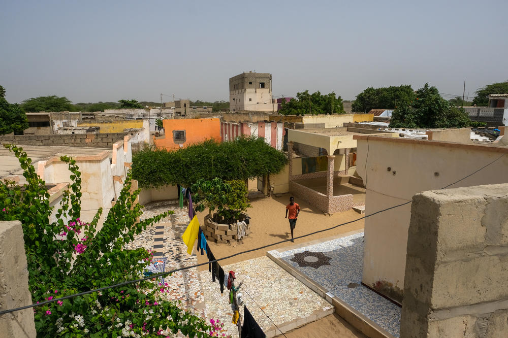 The view of Gandiol from Mamadou Niang's home. Nearly every tall building in the community, including the tallest building in the background here, was built with remittances sent back by Senegalese men working in Europe.