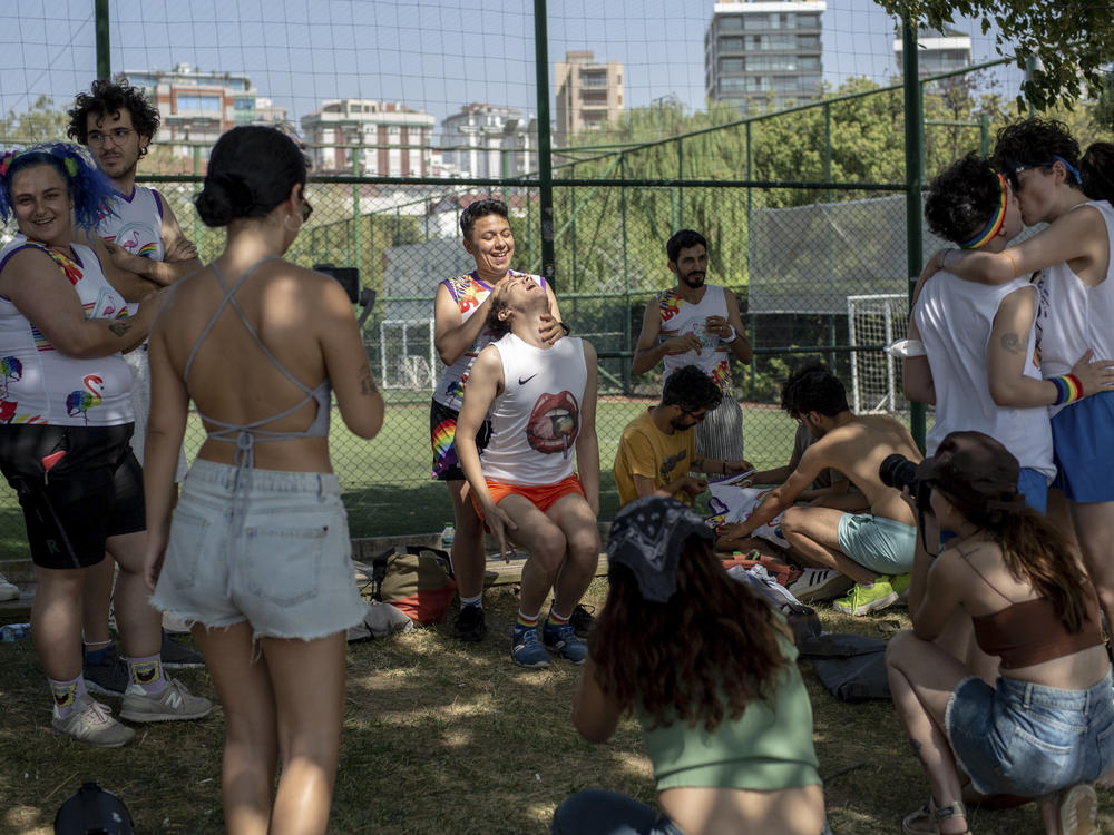 Participants hang out on the second day of Queer Olympix V in Kalamiş Park, Istanbul, on Aug. 28, 2021. The first Queer Olympix following a 2019 police ban and a 2020 hiatus due to the COVID-19 pandemic, the 2021 event was held in secrecy. This year, the Olympix were once again held at Kalamis, again in secret, with two lawyers present in case the police came.