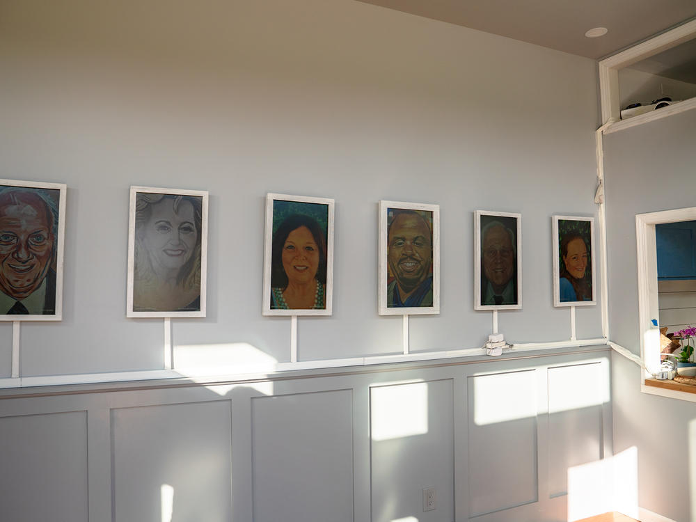 Portraits on various mediums honor health care workers who died of COVID-19.