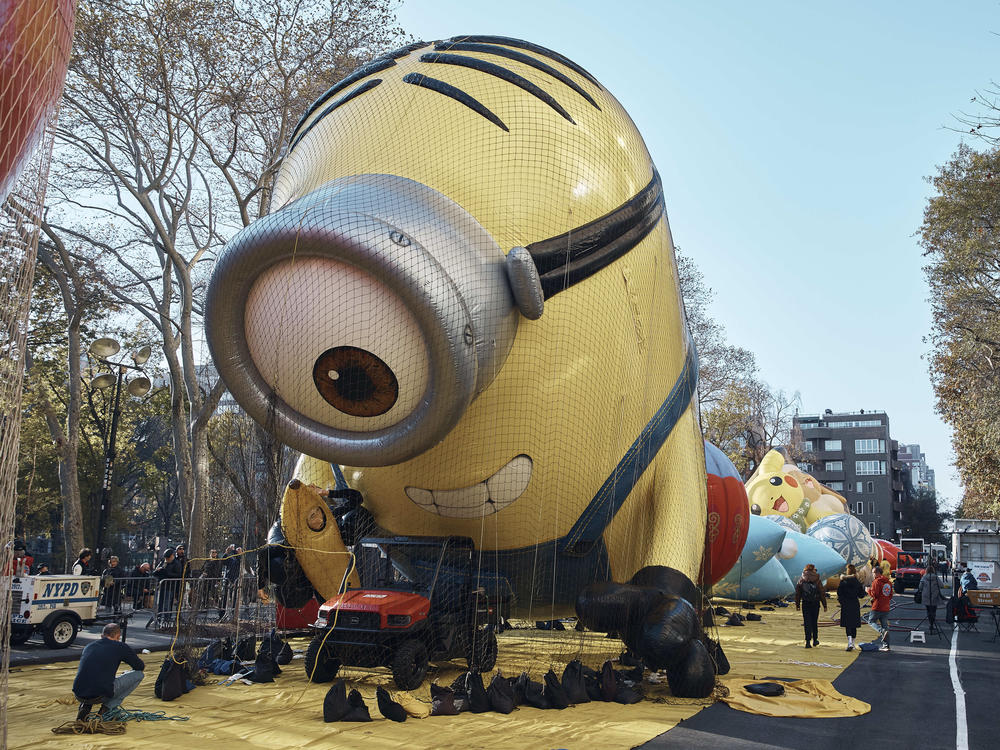 A man takes a photo of an inflated helium balloon of Stuart the Minion on Wednesday.