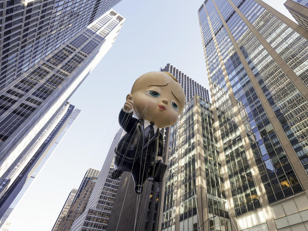 The Boss Baby balloon makes its way down Sixth Avenue during the Macy's Thanksgiving Day Parade.