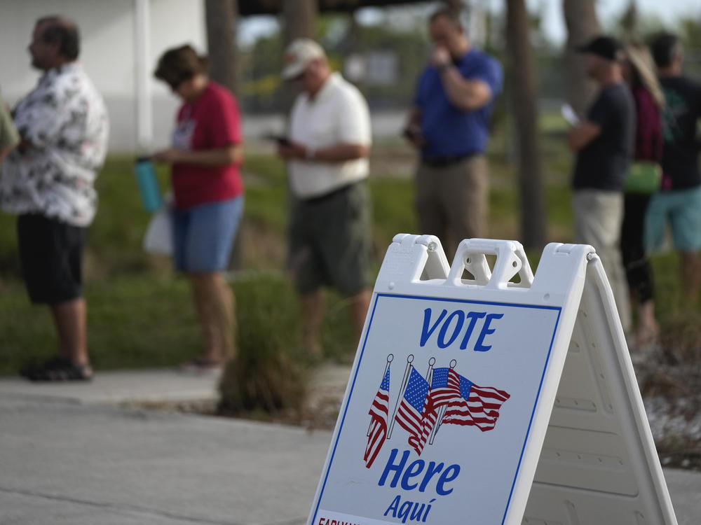 Lee County voters wait in line to cast their ballots at Wa-Ke Hatchee Recreation Center in Fort Myers, Fla., on Nov. 8.