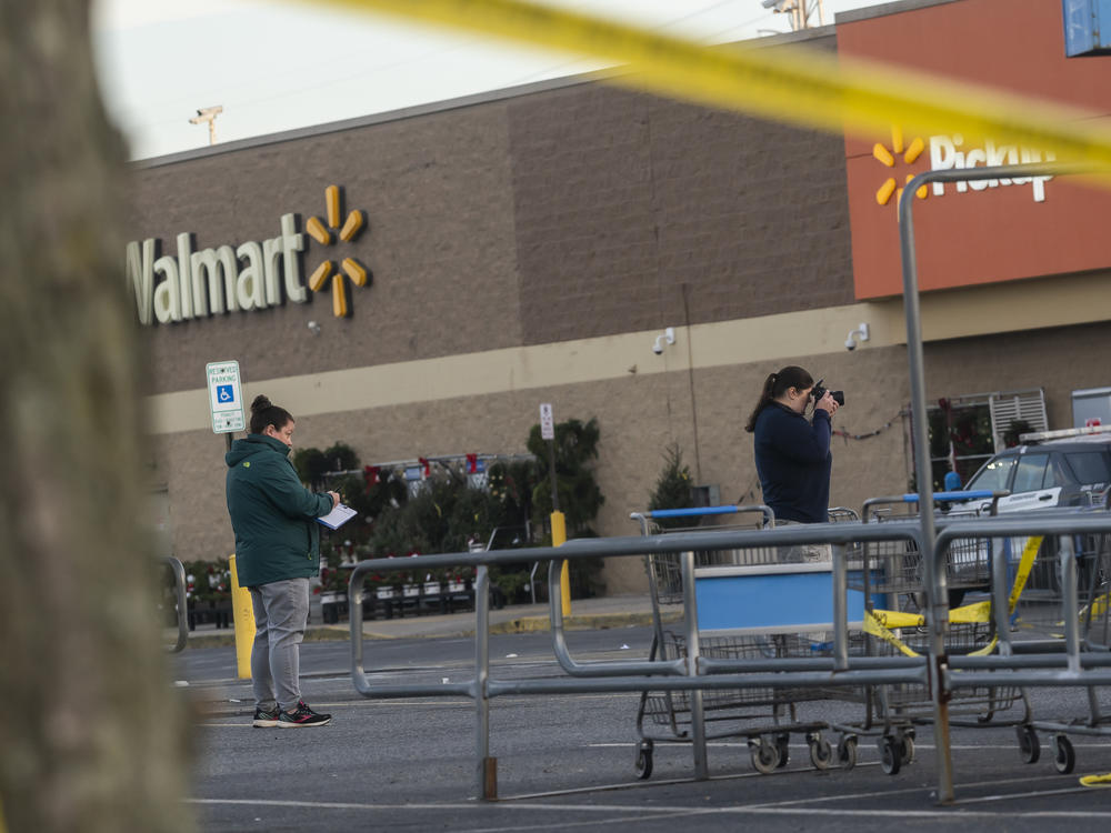 Members of the FBI investigate Tuesdays fatal shooting at the Chesapeake Walmart Supercenter on Wednesday in Chesapeake, Virginia. Six people, including the suspected gunman, are dead following.