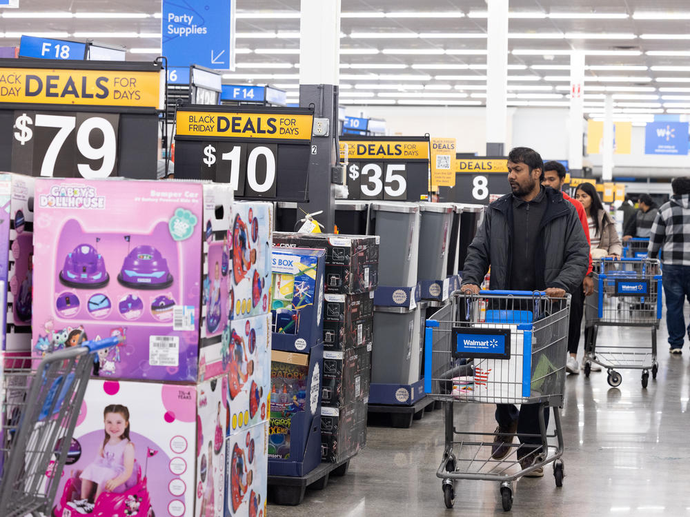 Shoppers walk the aisles of Walmart for Black Friday deals in Dunwoody, Georgia. Walmart opened at 6am on Black Friday for shoppers.