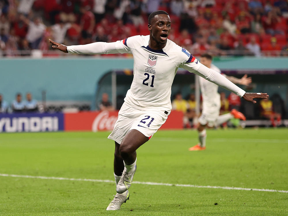 Tim Weah of the United States celebrates after scoring the team's goal during a World Cup match against Wales on November 21, 2022 in Doha, Qatar. Wales and the U-S finished 1-1.