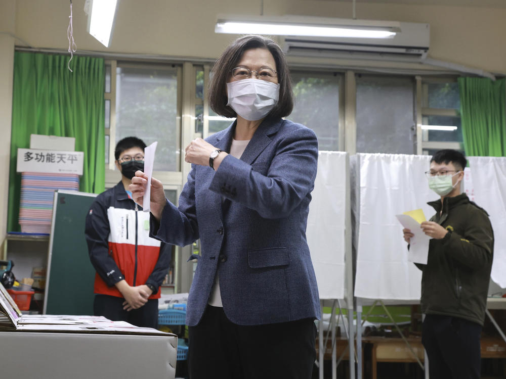 Taiwan President Tsai Ing-wen casts her ballots at a polling station in New Taipei City, Taiwan, on Saturday.