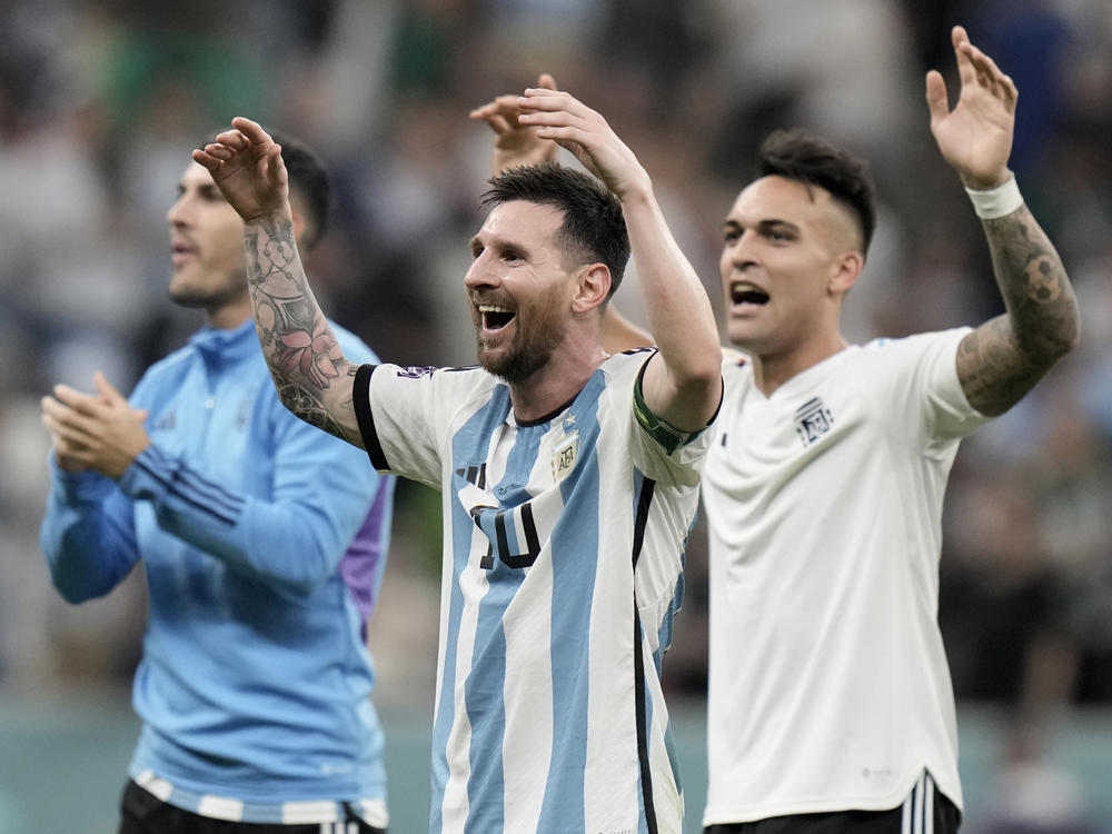 Argentina's Lionel Messi, center, celebrates at the end of the World Cup group C soccer match between Argentina and Mexico, at the Lusail Stadium in Lusail, Qatar, on Saturday. Argentina won 2-0.