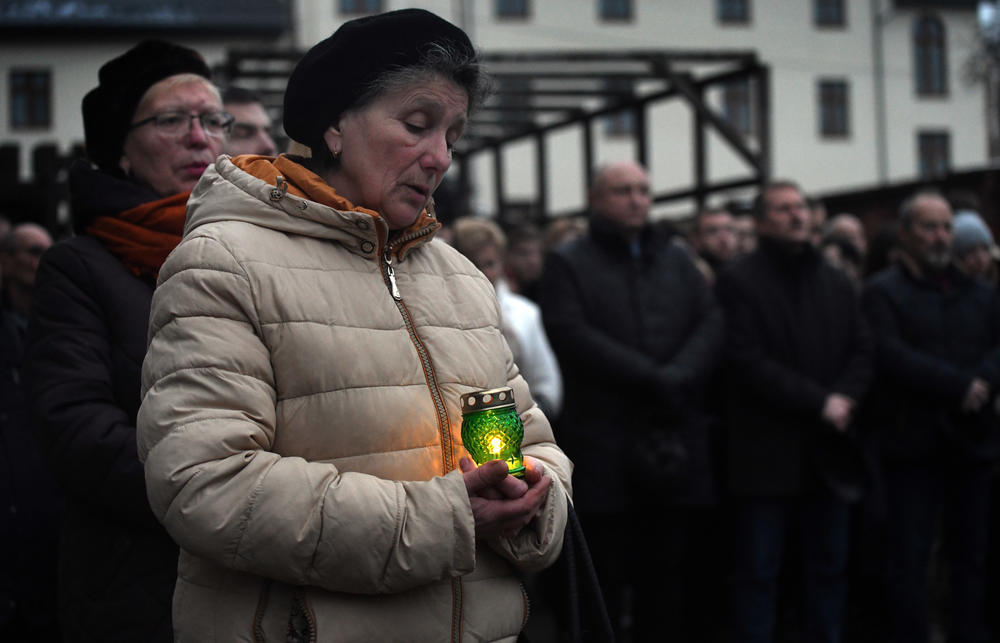 Residents pay tribute to victims of a great Soviet famine in the 1930s in Drohobych, Ukraine, on Saturday.