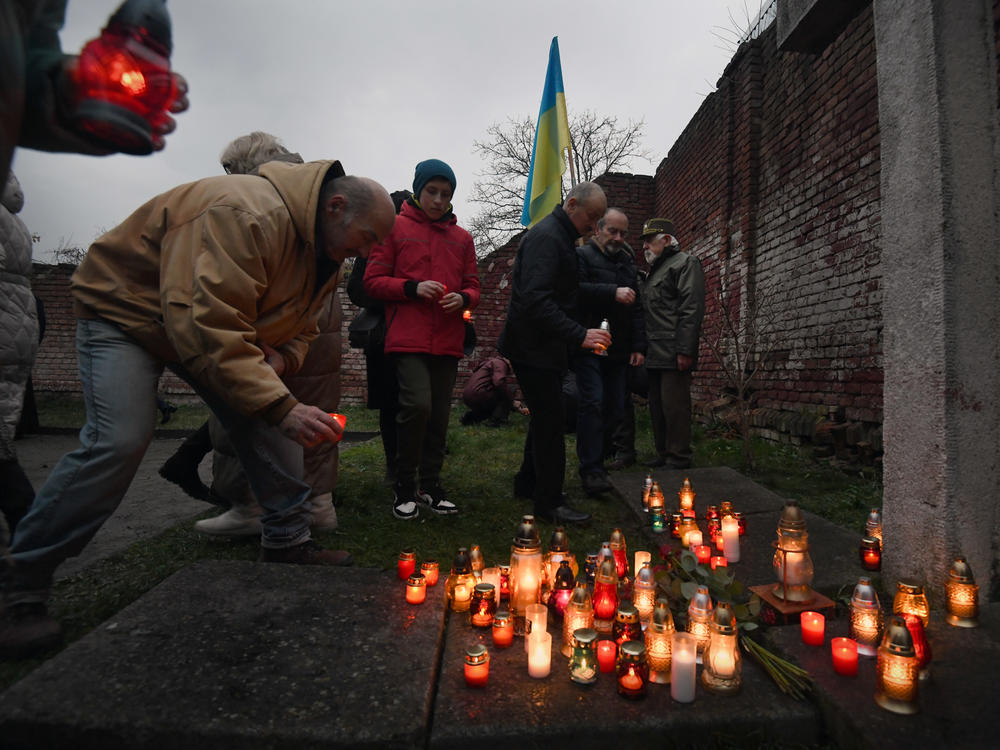 Residents hold a remembrance ceremony during the 90th anniversary of a great famine known as the Holodomor, at a museum in Drohobych, Ukraine, on Saturday.