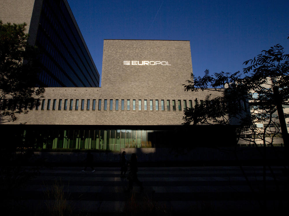 This Wednesday, Oct. 10, 2018, file photo shows the sun bouncing off the Europol headquarters in The Hague, Netherlands. Europol says law enforcement authorities in six different countries have joined forces to take down a 