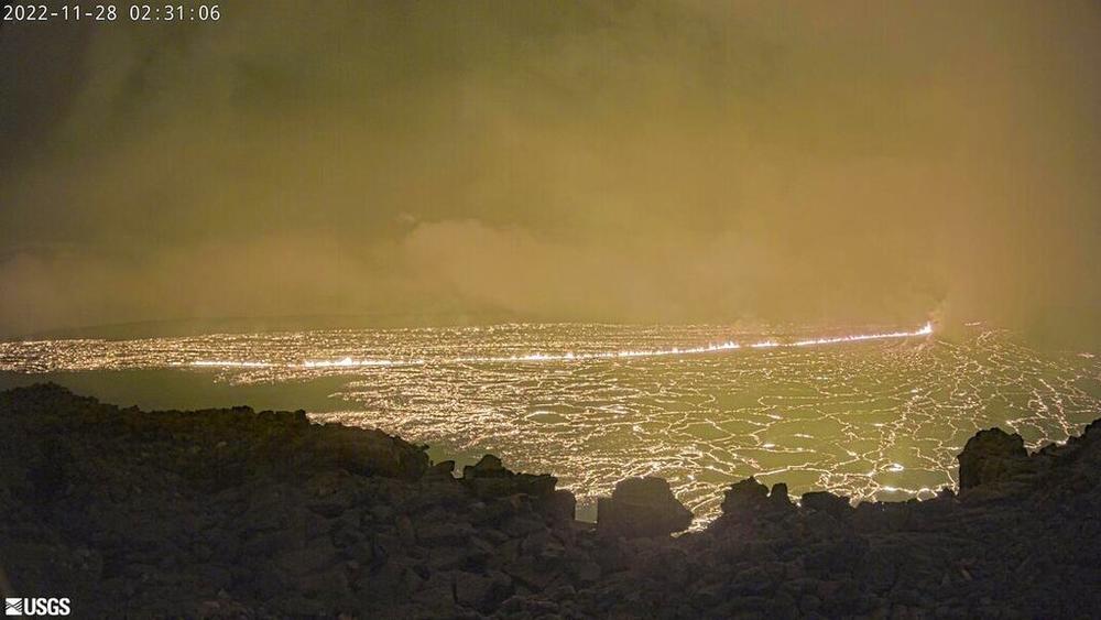 This image provided Monday by the USGS Hawaiian Volcano Observatory shows the inside of the summit caldera Mauna Loa volcano. The U.S. Geological Survey says that the eruption began late Sunday night, and that lava flows were contained within the summit area and so far weren't threatening nearby communities.