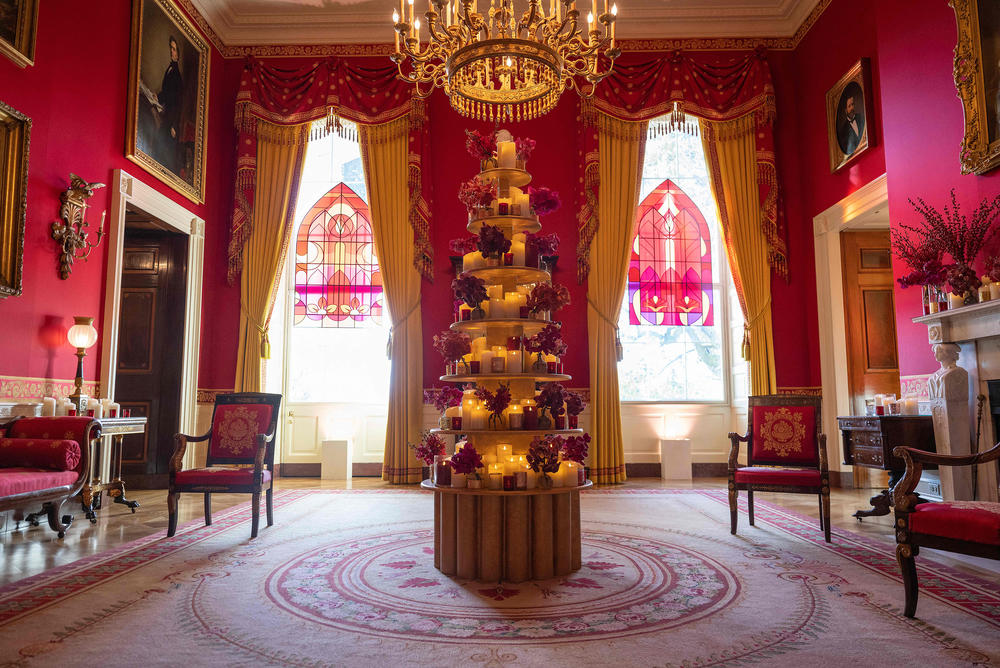 The Red Room is decorated with orchids, one of the first lady's favorite flowers — as well as fresh cranberries, which has been a White House tradition since 1975.