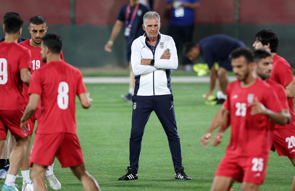 Iran's coach, Carlos Queiroz, heads a training session in Doha on Monday. Iran can tie the U.S. and still advance, but is expected to hold nothing back in pursuit of a win.