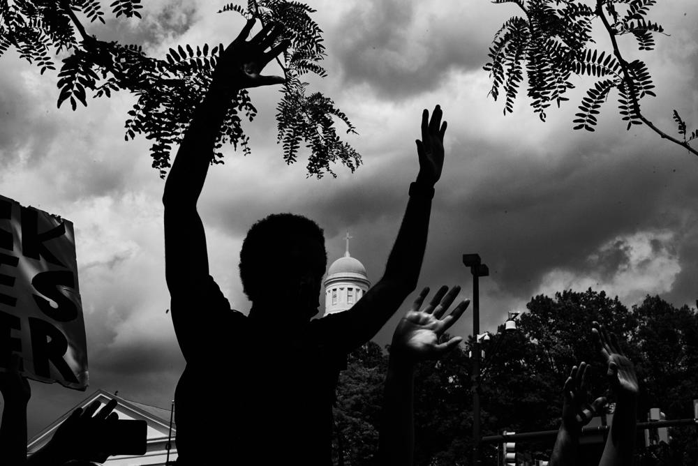 Protesters honor George Floyd, Breonna Taylor and Tony McDade in front of a police station in Baltimore, Md., in 2020.