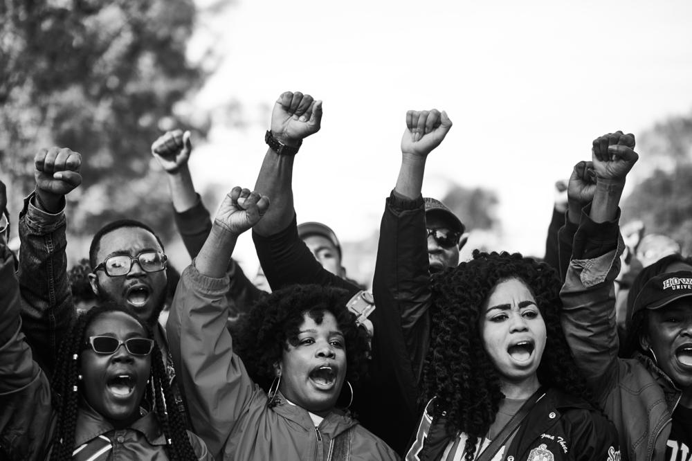 Protesters raise their fists at the October 2015 Million Man March in Washington, D.C.