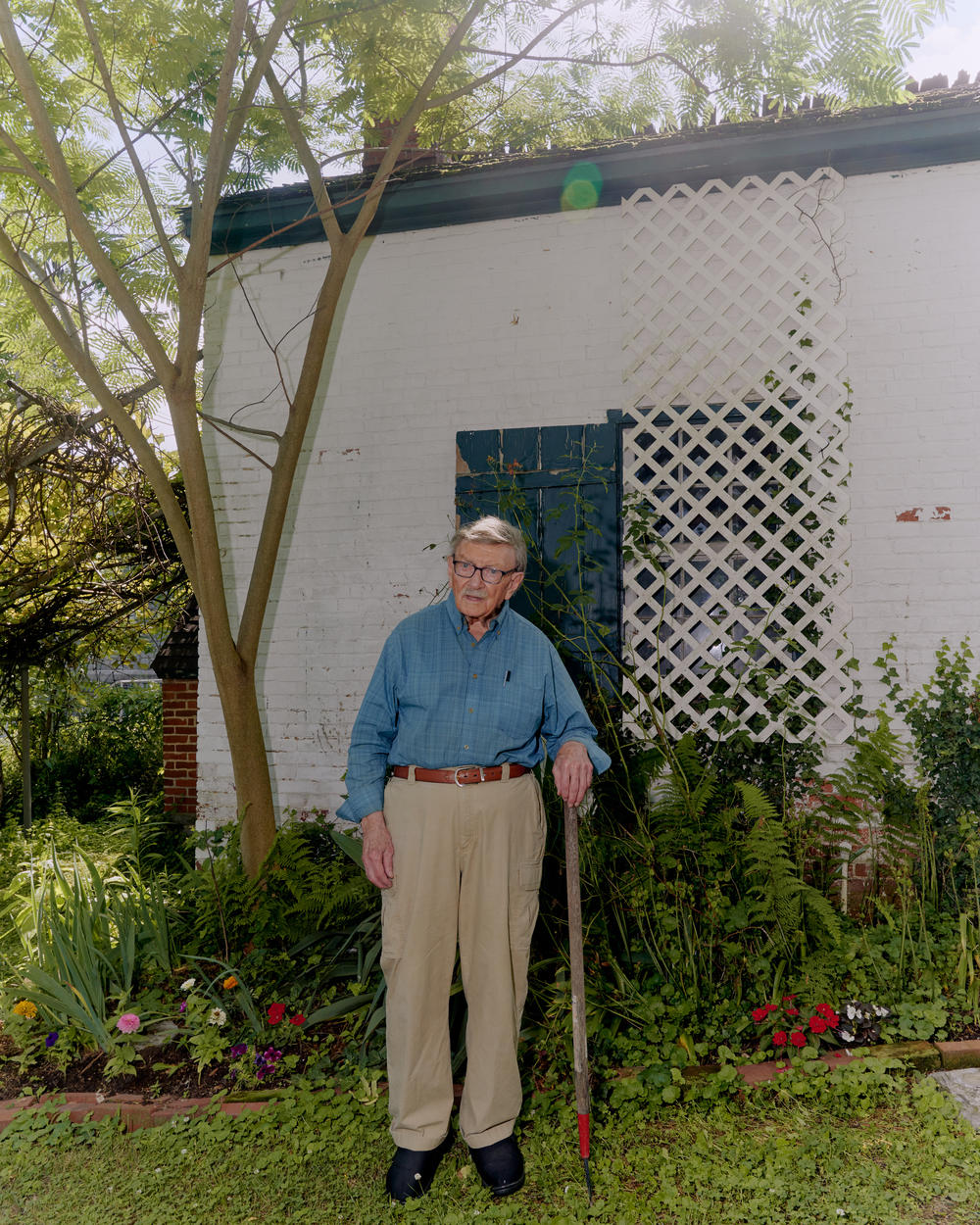 Brown poses for a portrait outside his home.