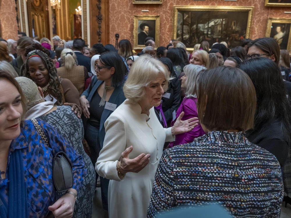 Charity leader Ngozi Fulani (center left) attends a reception held by Britain's Camilla, the queen consort, (center) to raise awareness of violence against women and girls in Buckingham Palace in London on Tuesday.