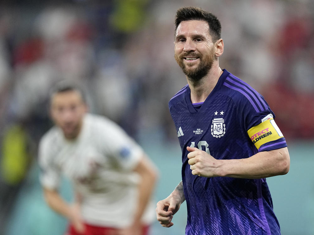 Argentina's Lionel Messi smiles during the World Cup group C soccer match between Poland and Argentina in Doha, Qatar, on Wednesday.
