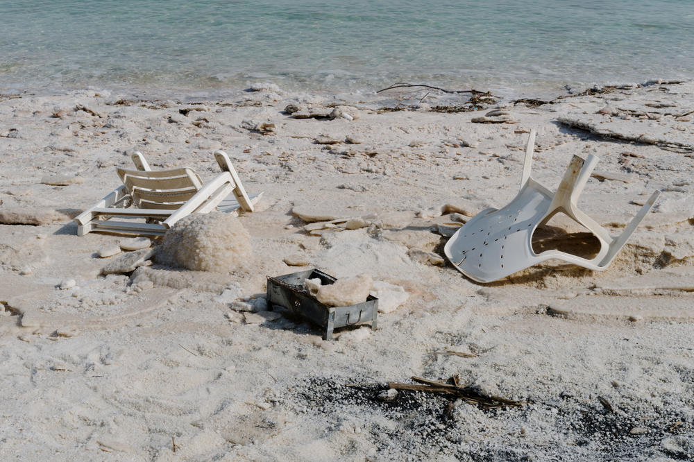 Plastic chairs and a mini barbecue abandoned on the shoreline of a permanently closed beach along the Dead Sea on Nov. 5.