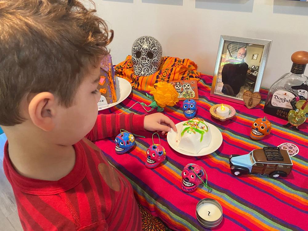 Daniella Quinones put up a Day of the Dead altar in November to honor her father who died last year. Her son, pictured here, asked if they could keep the altar up for a few more weeks.