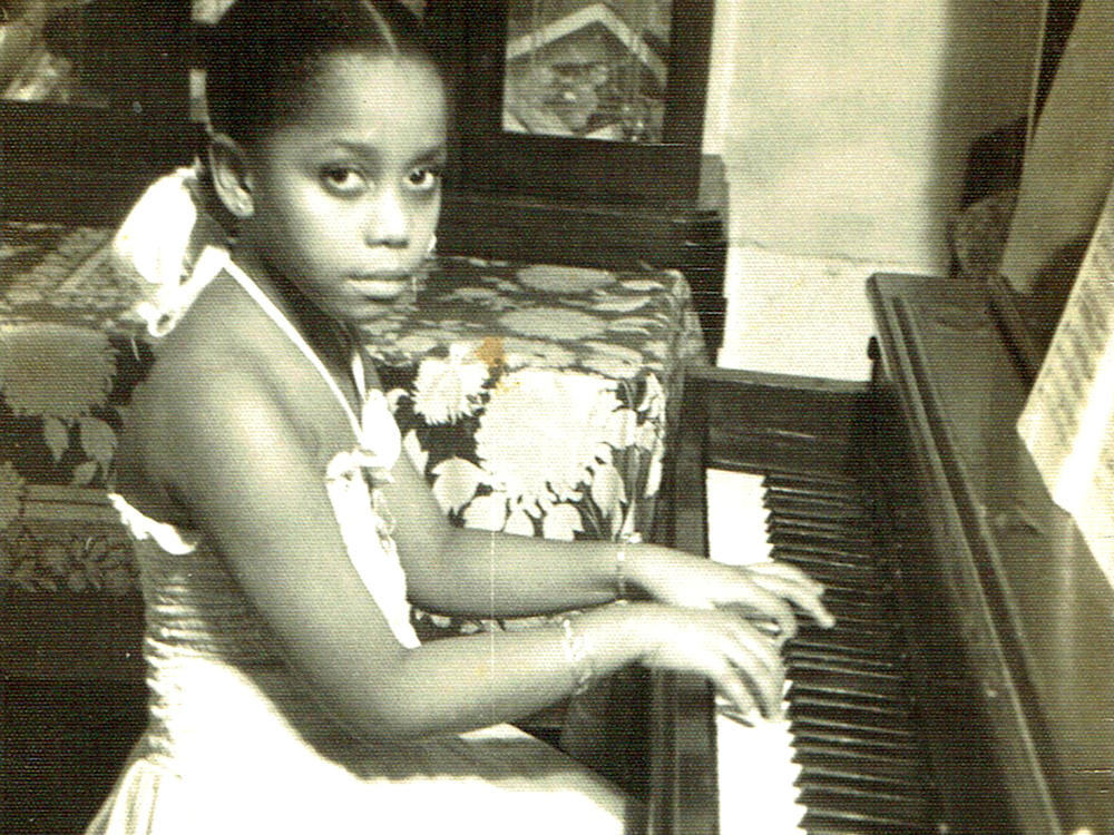 An 8-year-old Tania León practicing at her home in Havana, Cuba.