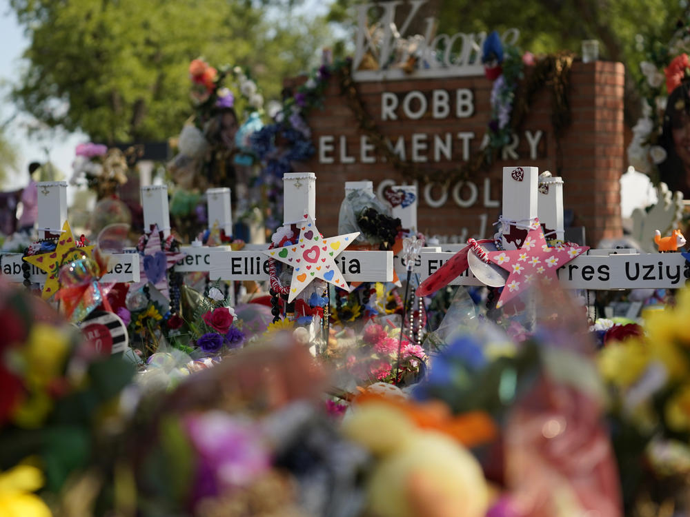 Crosses, flowers and other memorabilia form a make-shift memorial for the victims of the shootings at Robb Elementary School in Uvalde, Texas.