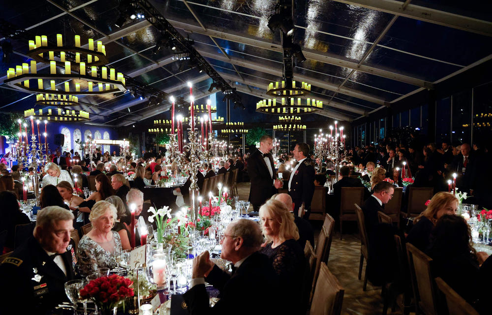 Chairman of the Join Chiefs of Staff General Mark A. Milley and others attend a state dinner for French President Emmanuel Macron on the South Lawn of the White House on Thursday in Washington, DC.