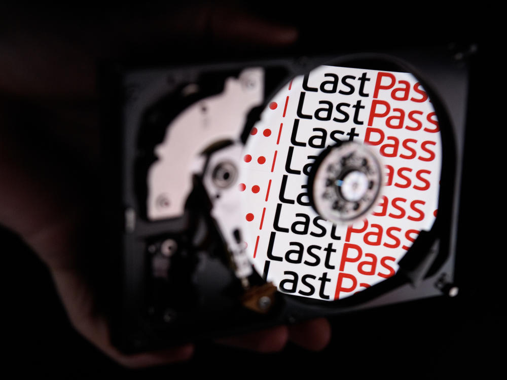In this photo illustration, the LastPass logo is reflected on the internal discs of a hard drive in 2017 in London. On Wednesday, the password service reported 