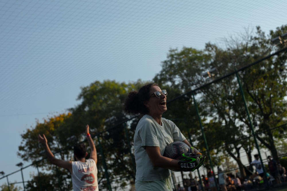 Ezgi, who often plays goalkeeper, holds the ball after a play during Queer Olympix VI in September 2022. Ezgi is a member of the queer soccer team Muamma (