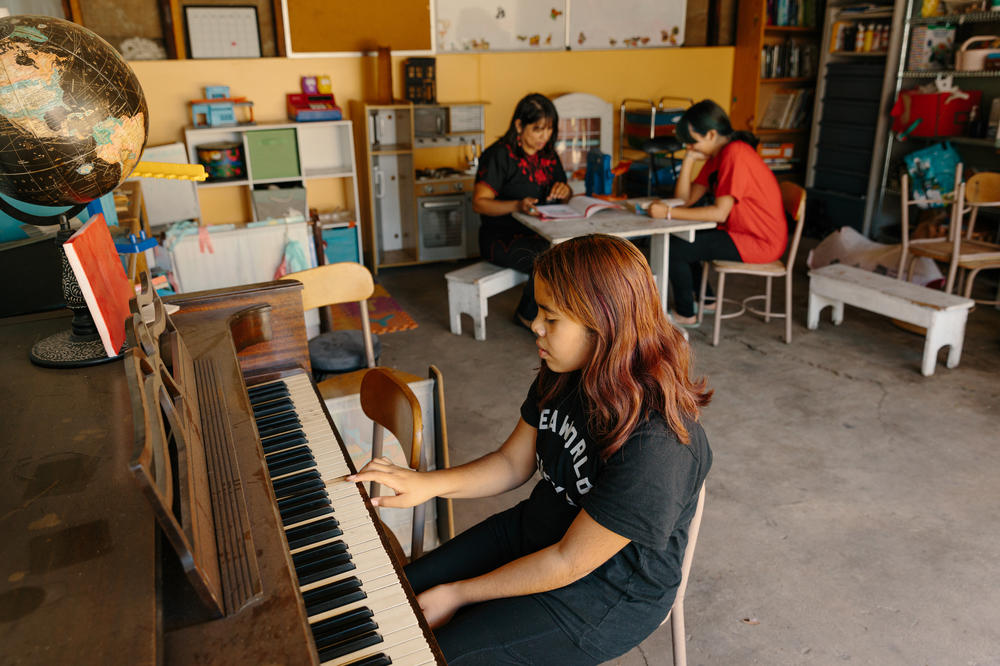 The Escudero family in their garage. Martha Escudero converted the home's garage into a homeschool for her own and other families' children during the pandemic.