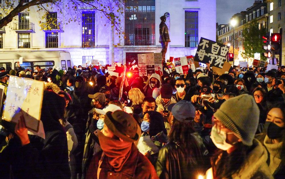 Hundreds of demonstrators gather outside the Chinese Embassy in London on Saturday to protest the Chinese government's 