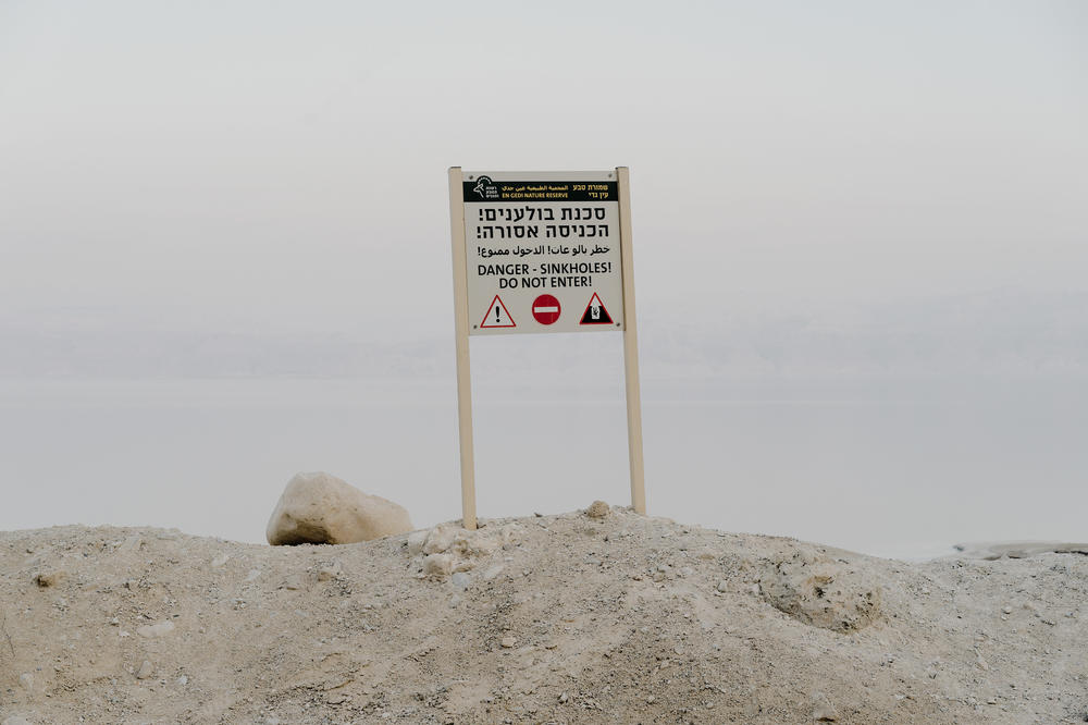 A sign warning of sinkholes near the Dead Sea.