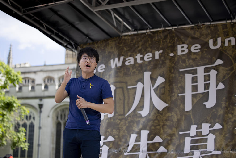 Simon Cheng, an activist from Hong Kong in exile in Britain, speaks at a rally at Parliament Square in London on June 12. Thousands of Hong Kongers in London gathered in support of a pro-democratic social movement in Hong Kong.