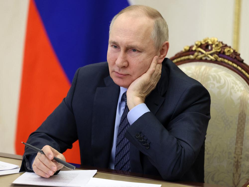 Russian President Vladimir Putin attends an event via video on Wednesday. The Kremlin is downplaying the prospect of Ukraine peace talks after President Biden said he would speak to Putin if 